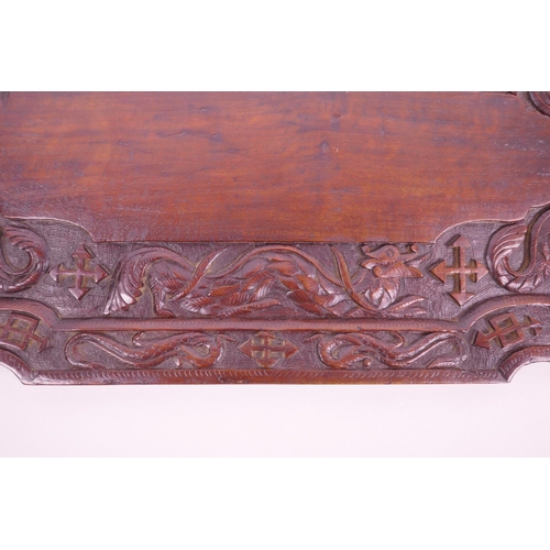 15 - An Oriental carved hardwood tray decorated with dragons and symbols, 24