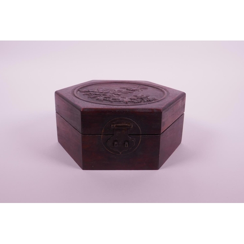 25 - A Chinese hexagonal hardwood box with carved decoration to cover of a bird and flowers, 6