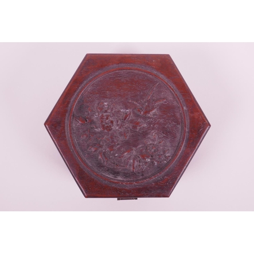 25 - A Chinese hexagonal hardwood box with carved decoration to cover of a bird and flowers, 6