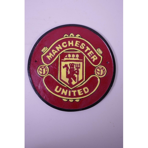 26 - Two painted cast iron plaques in the form of the football club crests for Arsenal and Manchester Uni... 