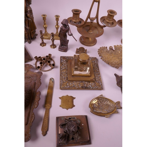 27 - A large collection of brass and copper decorative items to include candlesticks, ink pots, trinket d... 