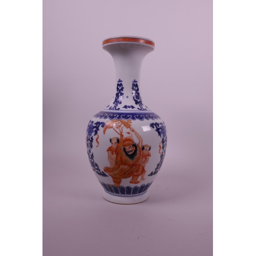 31 - A Chinese blue and white porcelain vase with iron red decoration of a bearded sage and his acolytes,... 