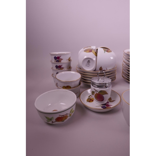 32 - A quantity of Royal Worcester Evesham pottery, including a part tea set and twelve ramekin dishes, c... 