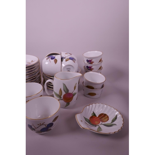 32 - A quantity of Royal Worcester Evesham pottery, including a part tea set and twelve ramekin dishes, c... 