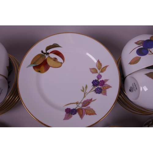 32 - A quantity of Royal Worcester Evesham pottery, including a part tea set and twelve ramekin dishes, c... 