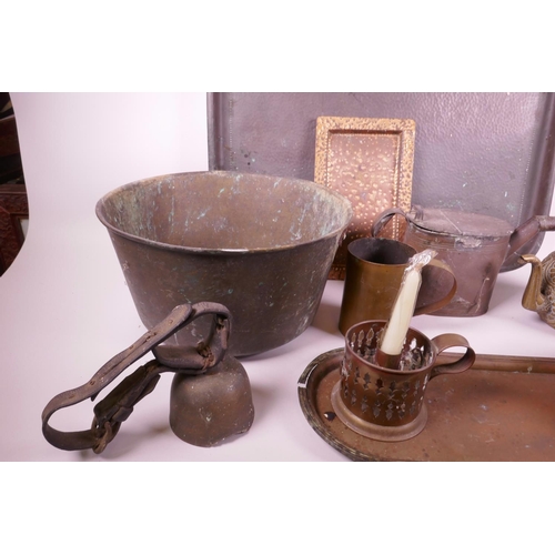 36 - A collection of brass and copper wares to include large copper trays, candles, teapots etc, largest ... 