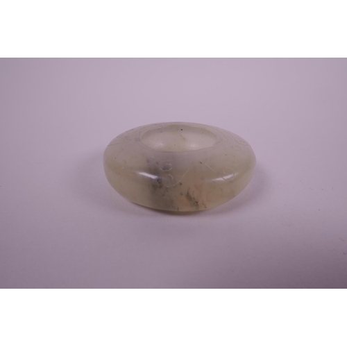 38 - A Chinese shallow jade water holder with carved cursive decoration, 2