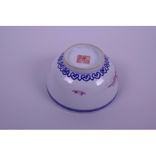 43 - A Chinese blue and white porcelain bowl decorated with a riverside landscape in puce enamels, seal m... 