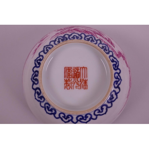 43 - A Chinese blue and white porcelain bowl decorated with a riverside landscape in puce enamels, seal m... 