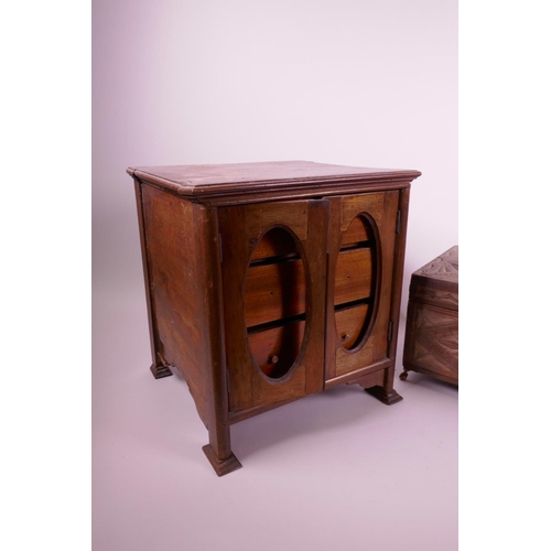 47 - A mahogany three drawer smoker's cabinet and a carved wood jewellery box on brass pawed feet, cabine... 