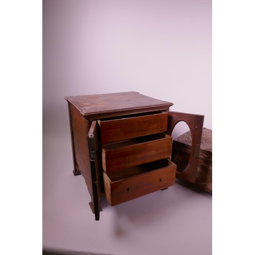 47 - A mahogany three drawer smoker's cabinet and a carved wood jewellery box on brass pawed feet, cabine... 