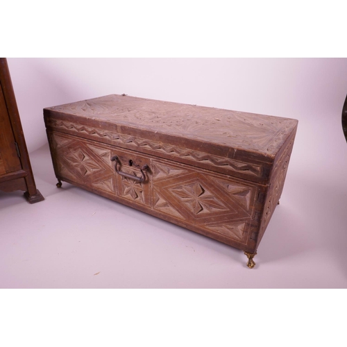 47 - A mahogany three drawer smoker's cabinet and a carved wood jewellery box on brass pawed feet, cabine... 