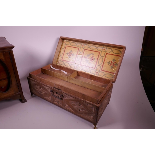 47 - A mahogany three drawer smoker's cabinet and a carved wood jewellery box on brass pawed feet, cabine... 