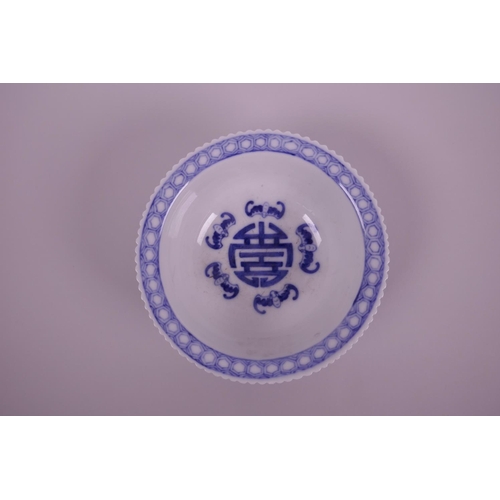 5 - A Chinese blue and white porcelain bowl with a frilled rim, decorated with kylin, bats and auspiciou... 