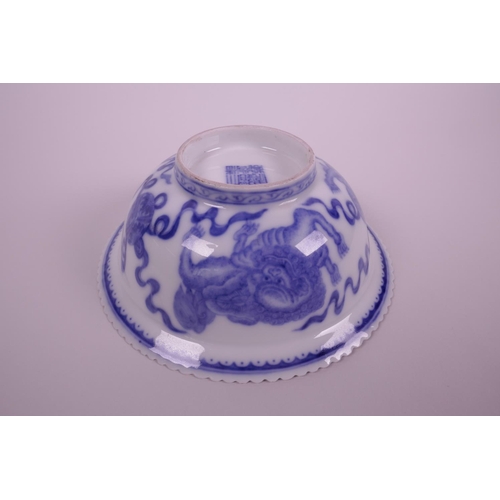 5 - A Chinese blue and white porcelain bowl with a frilled rim, decorated with kylin, bats and auspiciou... 