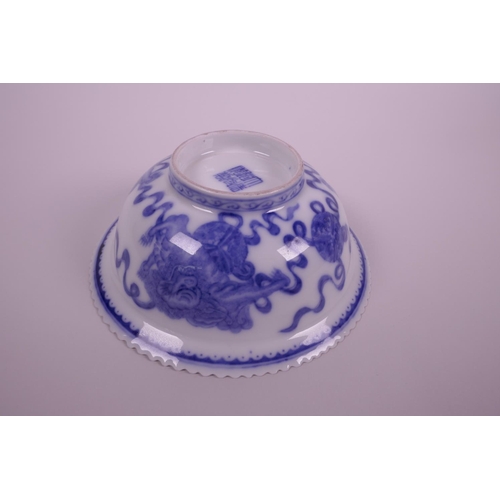 5 - A Chinese blue and white porcelain bowl with a frilled rim, decorated with kylin, bats and auspiciou... 