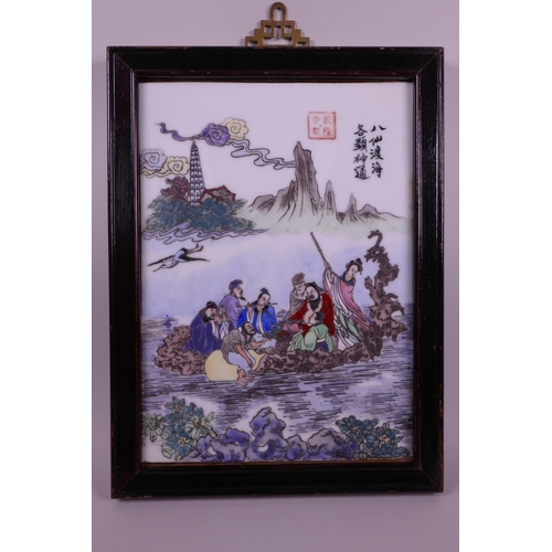 53 - A Chinese polychrome enamelled porcelain plaque depicting the eight immortals on a rootwood boat, in... 