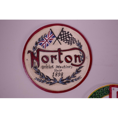 6 - Three painted cast iron wall plaques in the form of motor racing badges, largest 11½