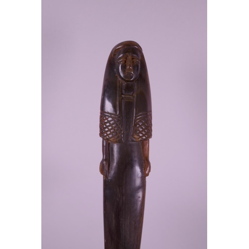 299 - A carved horn statue of an ancient Egyptian woman, 7