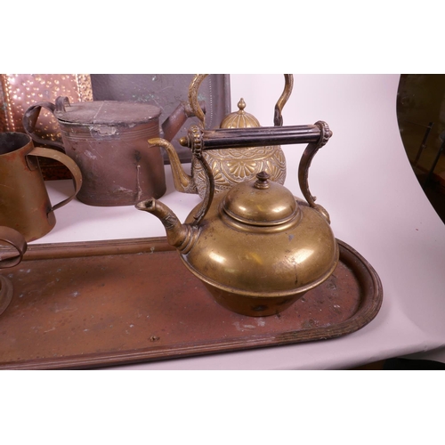 334 - A collection of brass and copper wares to include large copper trays, candles, teapots etc, largest ... 