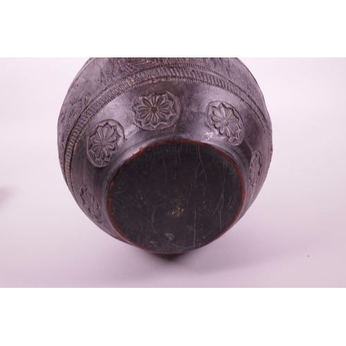 267 - A Continental black glazed terracotta jar with raised decoration of a wedding procession, 8½