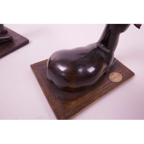 277 - A pair of late C19th carved rhino horn figures of antelope, mounted on horn bases, 4½