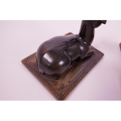 277 - A pair of late C19th carved rhino horn figures of antelope, mounted on horn bases, 4½