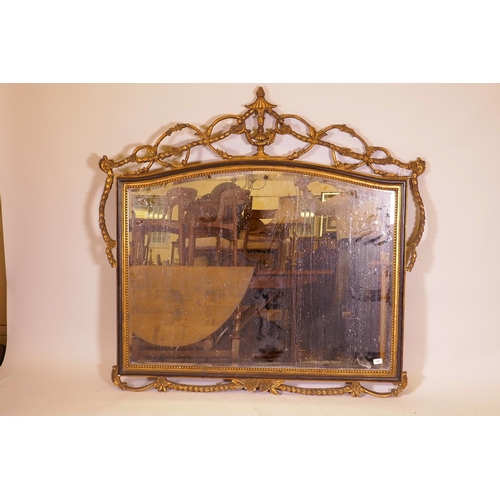 1177 - A contemporary wall mirror with pierced frame and ebonised and parcel gilt decoration, 57