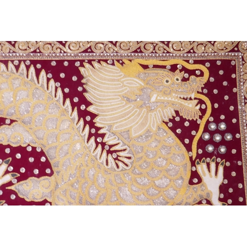 1165 - A large Oriental beaded jewelled and tapestry wall hanging of a dragon, 68