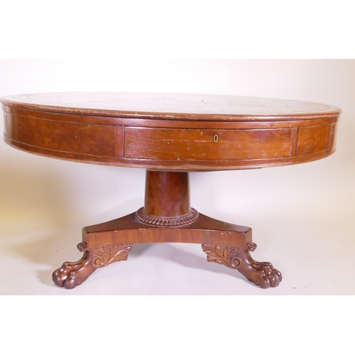 1166 - A C19th circular mahogany drum table with leather inset top, four frieze drawers on pedestal support... 