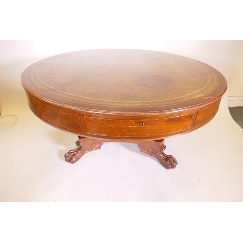 1166 - A C19th circular mahogany drum table with leather inset top, four frieze drawers on pedestal support... 