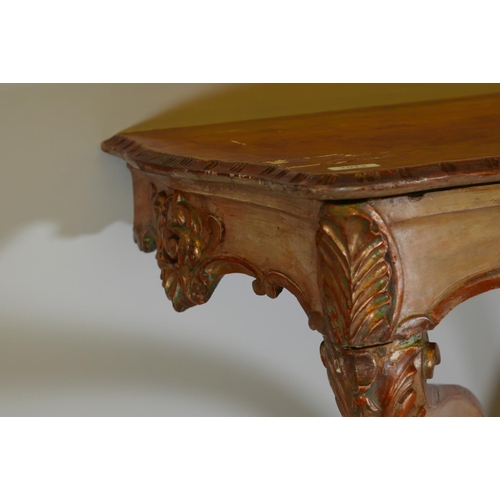 1170 - A C19th Italian painted and parcel gilt console table with shaped top and carved frieze, raised on s... 