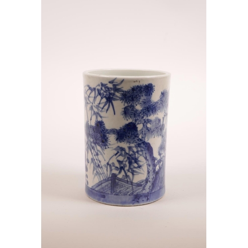 15 - A Chinese blue and white porcelain brush pot, decorated with bamboo and cypress trees in a landscape... 