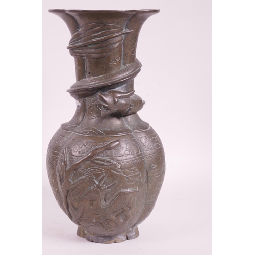 29 - An early C19th Chinese bronze vase with bulbous body and flared rim, the neck applied with an entwin... 