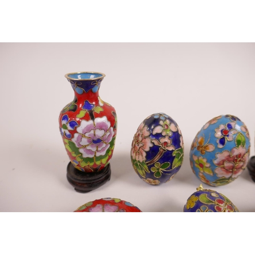 38 - A quantity of Chinese cloisonné to include two vases, two eggs, three pill boxes and a pig figurine,... 