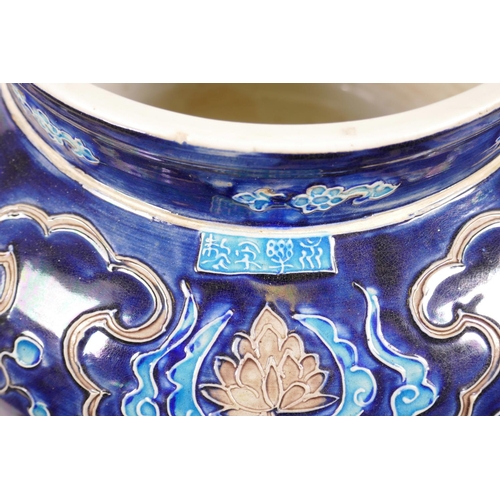 53 - A large Chinese blue ground pottery jardiniere with applied decoration of a lotus pond, 12