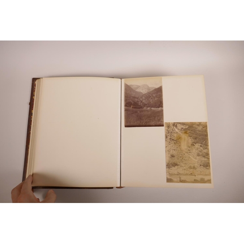 74 - A good early C20th photograph album depicting topographical scenes from around the world, some possi... 