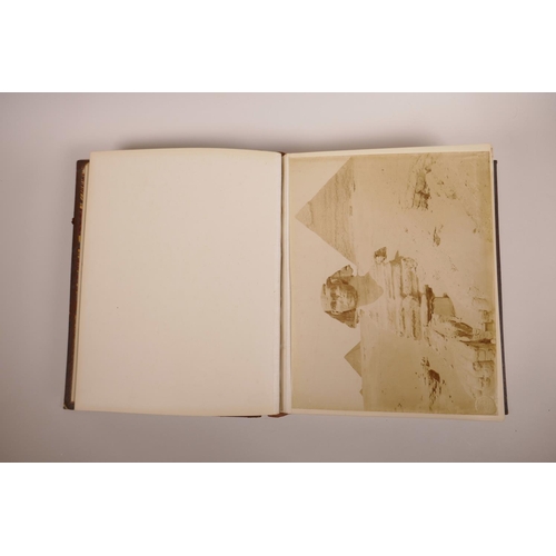 74 - A good early C20th photograph album depicting topographical scenes from around the world, some possi... 