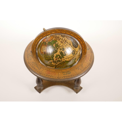 13 - A miniature composition terrestrial globe, 9