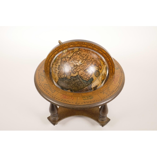 13 - A miniature composition terrestrial globe, 9