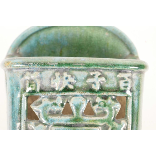 15 - A Chinese green crackle glazed pottery wall bracket with archaic style decoration, 4 character mark ... 