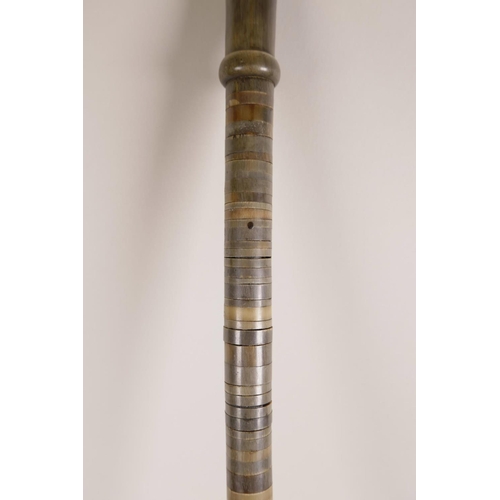 19 - A horn handled walking stick, possibly rhino, with a horn ringed shaft, 33½