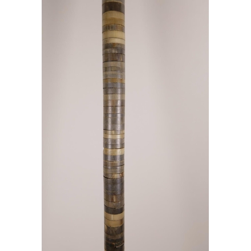 19 - A horn handled walking stick, possibly rhino, with a horn ringed shaft, 33½