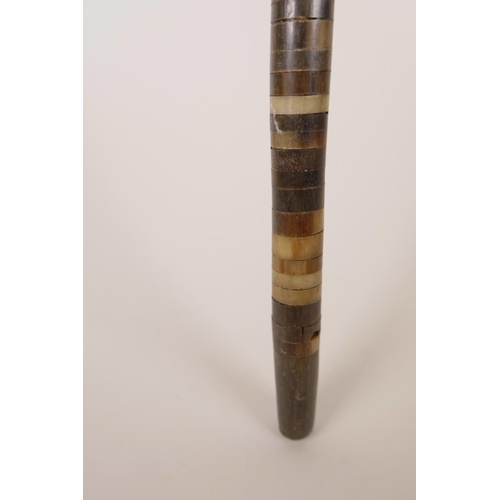 19 - A horn handled walking stick, possibly rhino, with a horn ringed shaft, 33½