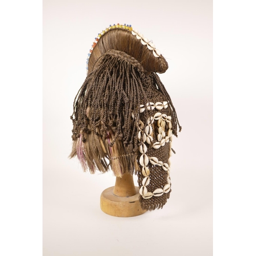 27 - An African tribal woven hair and shell mask