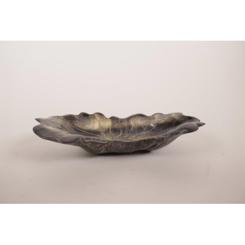 30 - A Chinese carved faux horn trinket dish in the form of a lotus leaf, 5