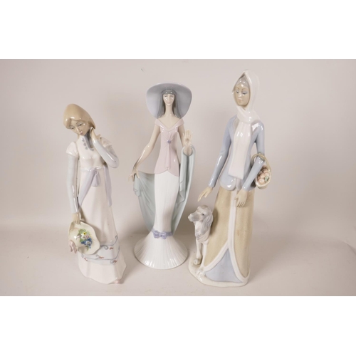 44 - A Lladro porcelain figure of a lady in a large hat, 13½