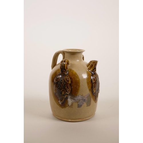 45 - A small Chinese brown glazed wine pourer with raised glazed vine decoration, 4½