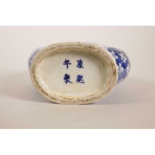 48 - A small Chinese blue and white porcelain moon flask with two handles in the form of ruyi, decorated ... 