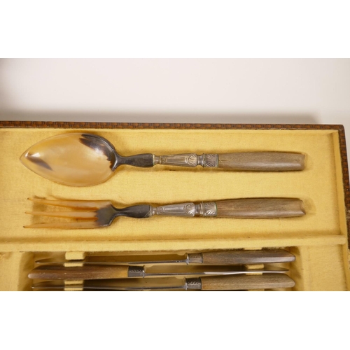 49 - A canteen of horn handled cutlery to include dinner and dessert knives, salad servers and a carving ... 